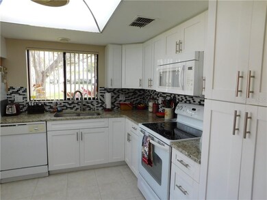 Open And Bright Kitchen With Two Windows