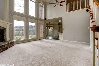 Great room with gas fireplace and plenty of light.