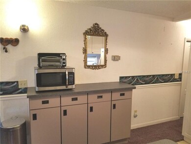 Kitchen back cabinets with microwave.