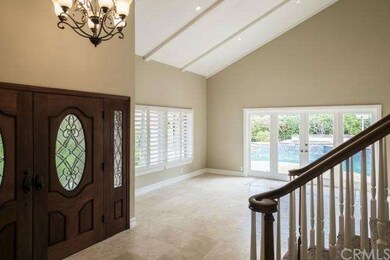 Vaulted foyer and vaulted living room