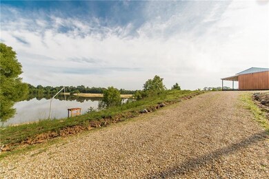 Driveway to home with view of the river