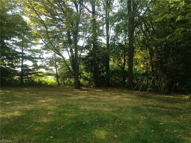 Scenic back yard backs to woods.