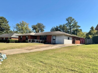 Ranch-style house with a front lawn