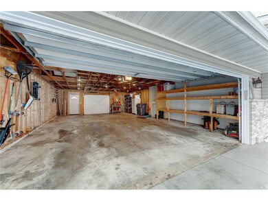 988 Square Feet with Front and Back Garage Doors. 