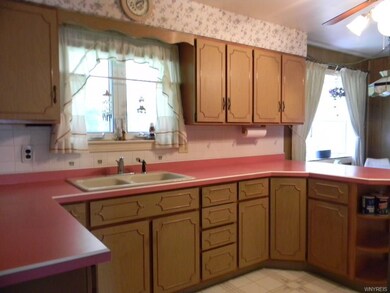 Lots of cabinets in this eat in kitchen.