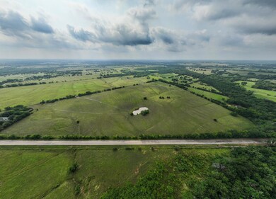 Birds eye view of property featuring a rural view