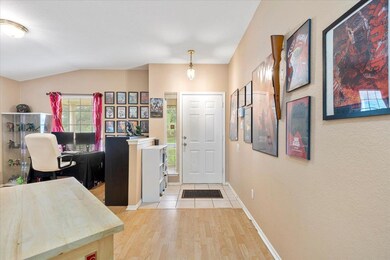 Foyer entrance with light wood-type flooring, bas