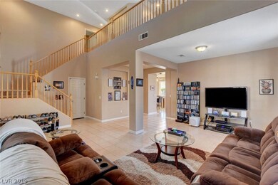 Two story living and entry open to loft upstairs