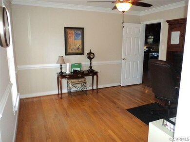 Formal Dining Room with chair rail, crown molding