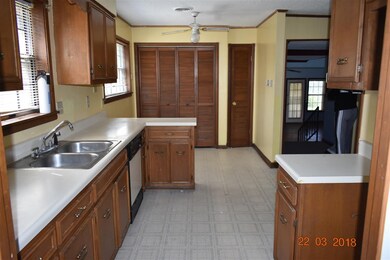 View of the laundry closet behind the double doors
