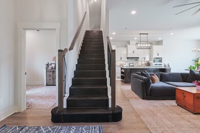 Stairs leading to upstairs bonus room.