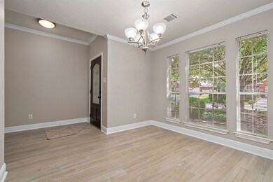 Formal dining with lots of windows for natural light!