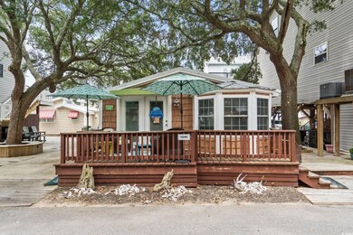 Shotgun-style home featuring a wooden deck