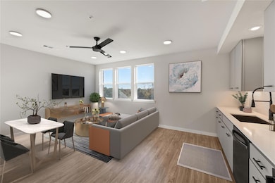 Living area featuring light wood finished floors,