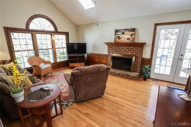 Gorgeous family room with hardwoods, palladian win