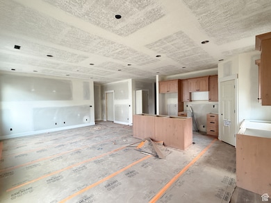 Kitchen featuring a kitchen island and open floor plan