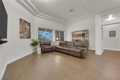 Living room with wood finished floors, baseboards,