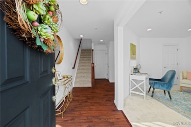 Entry foyer with coat closet, powder room, and acc