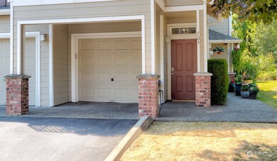 Unit entry and attached garage are located in the right corner of the building on ground level for easy access.