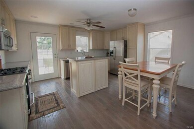Kitchen and Dining Area has hardwood floors. Door 