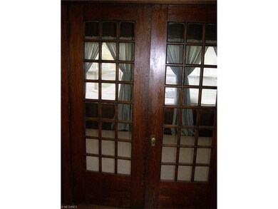 Wood French doors to bonus room