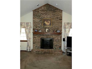 Other. A brick fireplace warms an otherwise spacio