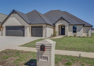 French provincial home featuring a garage and a fr