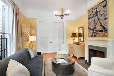 Main House: Living Room with pocket doors to dining room.