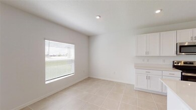 REPRESENTATIVE PHOTO. Thecasual dining area has pl