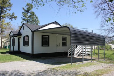2 Car Carport and Covered Deck on side of Home.