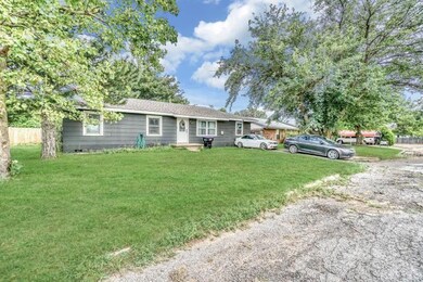 Ranch-style home with a front lawn