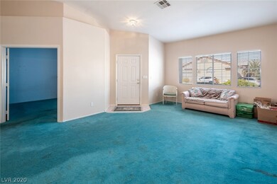 Living room, den through double doors on the left.