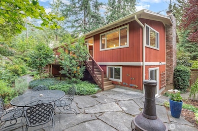 Patio in lovely & private landscaped backyard.
