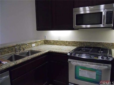 Stainless steel appliances with granite countertop