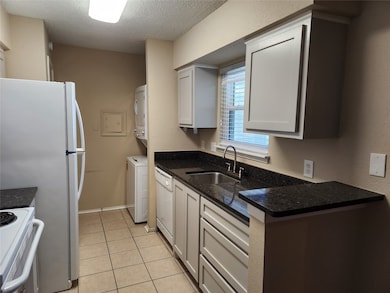 Kitchen includes new refrigerator and washer and d
