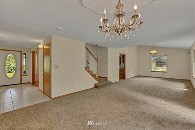 Entry on the left with two bedrooms or offices to each side. Great room and dining room on the right.