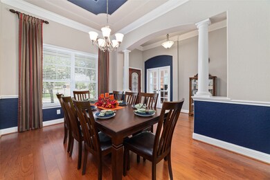 The formal dining room features plenty of space for a large table, as well as serving pieces. Windows at the front of the house offer both the dining room and the study great views of the front garden.