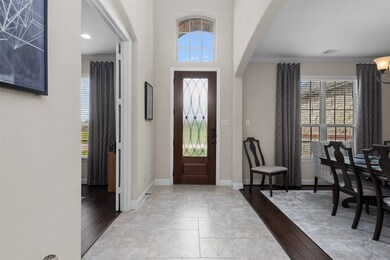 Upon entering, you have the home office with french doors on one side and the formal dining room on the other. Both these rooms boast hand scraped hardwood flooring.