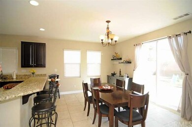 Family Dining area with Tile flooring
