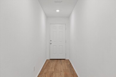 Doorway to outside featuring light wood-type floor
