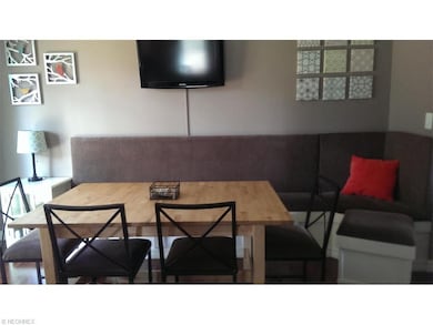 The dining room has a built in banquette with stor