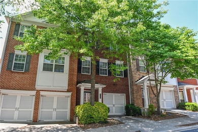 Townhome / multi-family property with brick siding