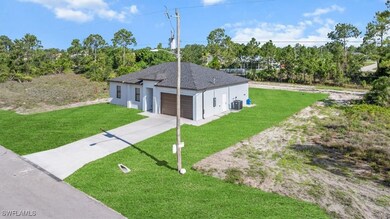 Ranch-style home with a front lawn, concrete drive