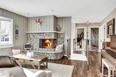 Living Room w/ Wood Burning Fireplace