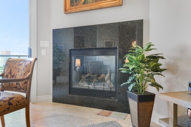 Enjoy the ambiance of a cozy gas fireplace in the living room.