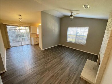 Unfurnished living room with lofted ceiling, visi