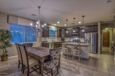 Dining off Kitchen w/ Custom Lights