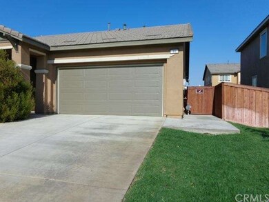 Rt. side view showing gate with cement walkway to 