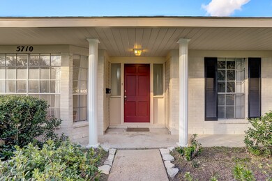 Enter this charming home through a large covered f