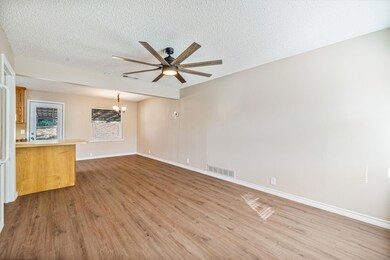 Unfurnished room featuring a textured ceiling, cei